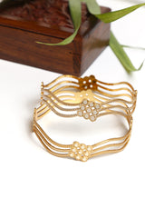 Gold Bangle Set with Flowing Lines and Floral Motif