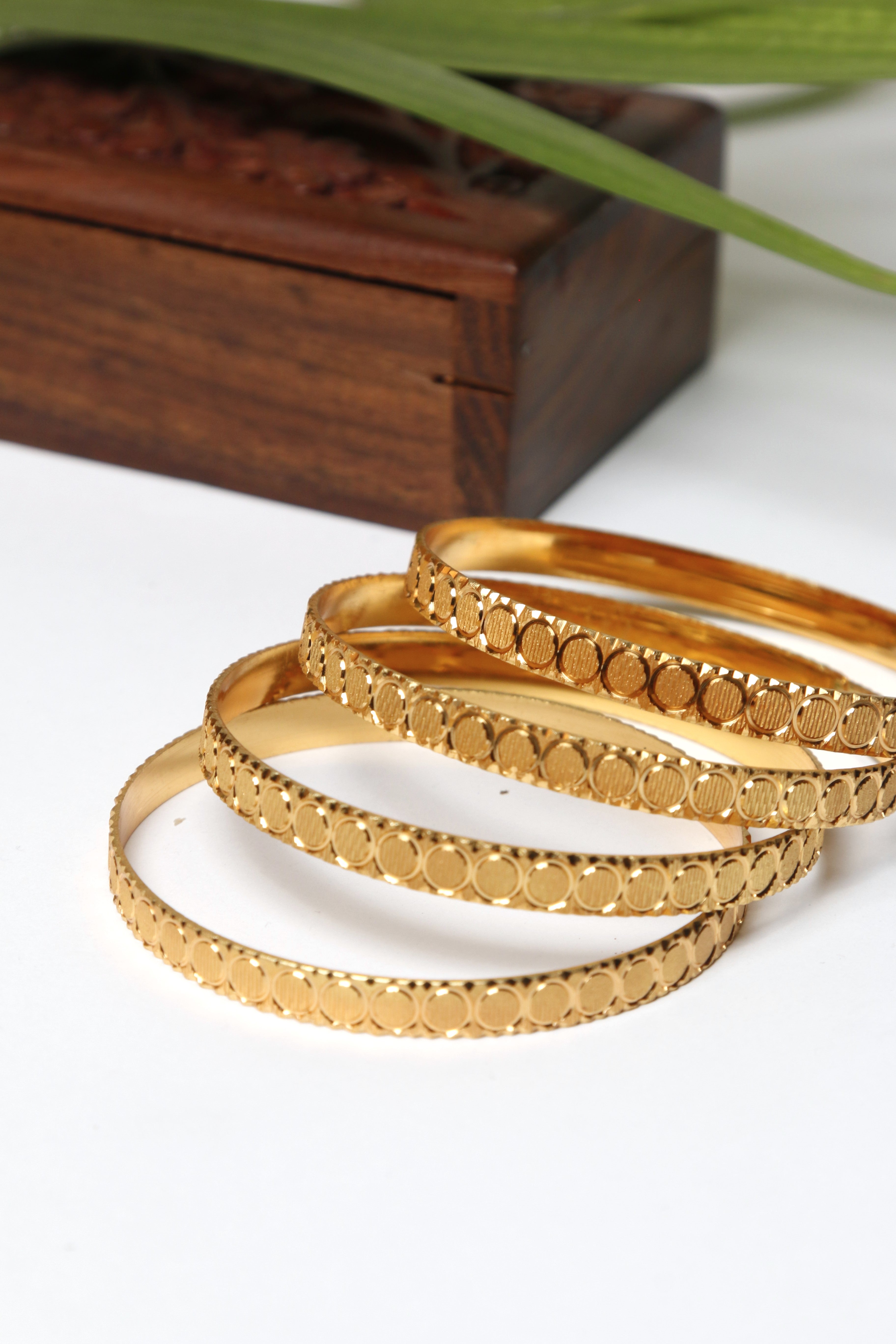 Gold Bangle Set with Elegant Circular Patterns