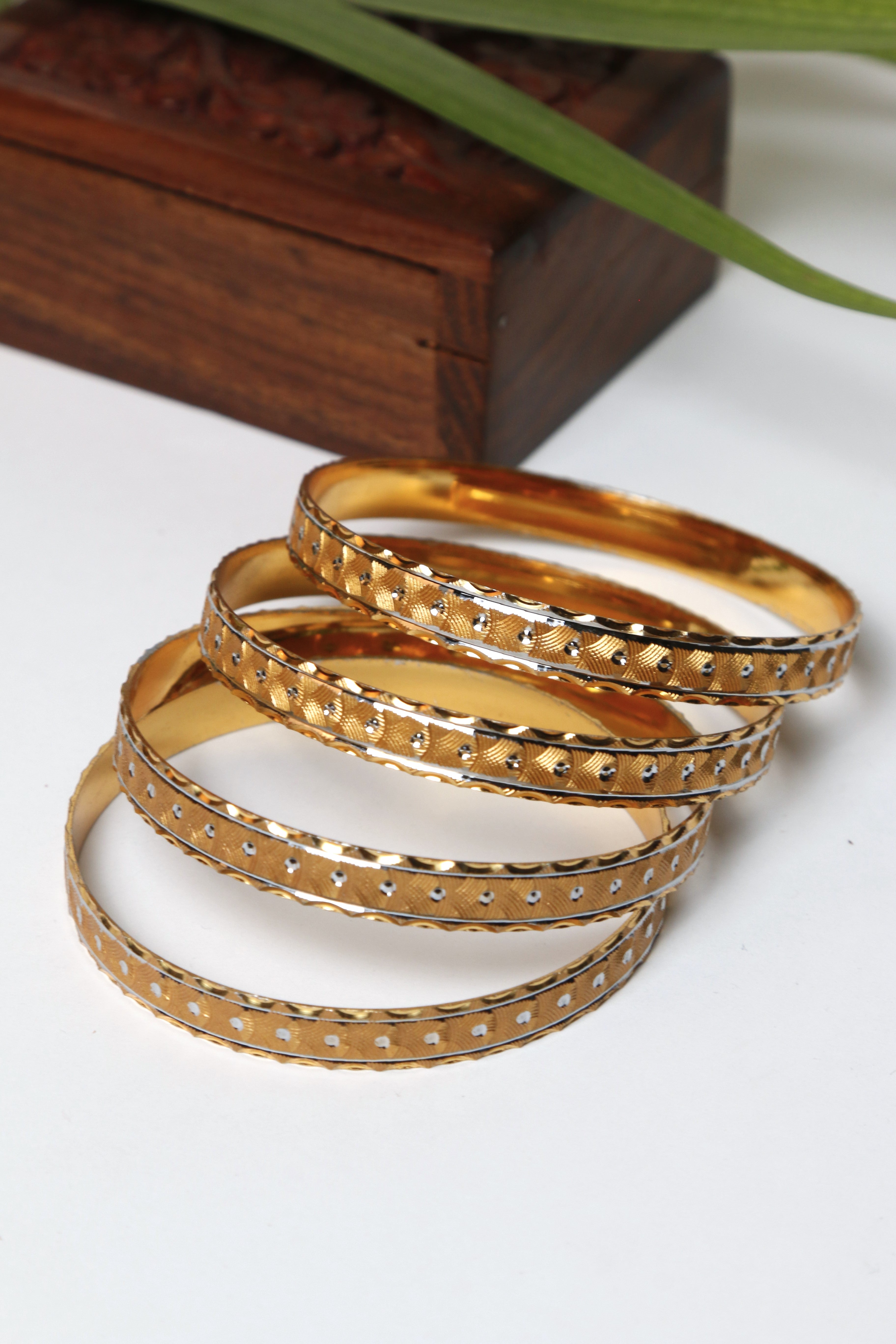 Gold Bangle Set with Geometric Pattern and Beaded Design
