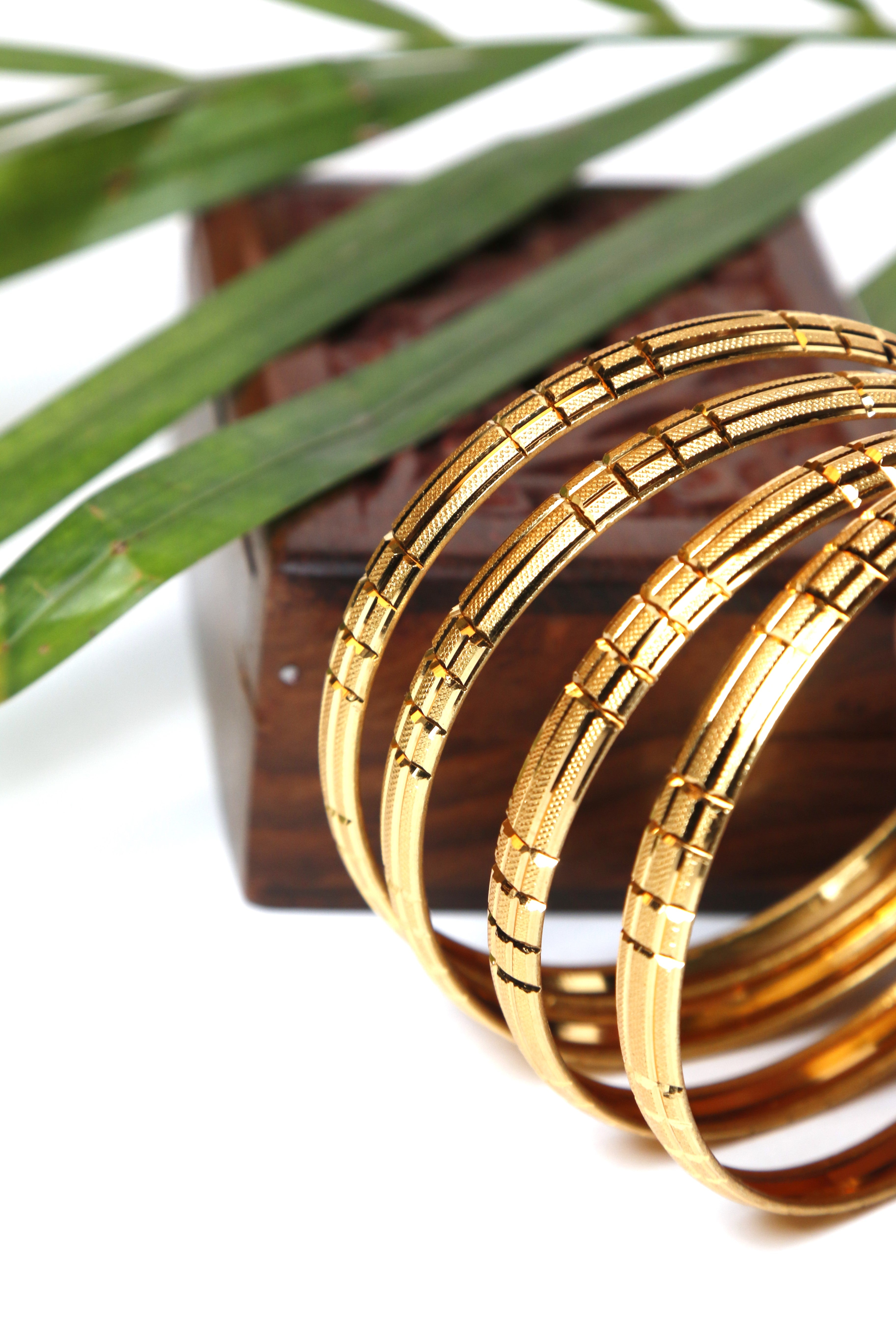 Modern Textured Imitation Gold Bangles – Set of 4