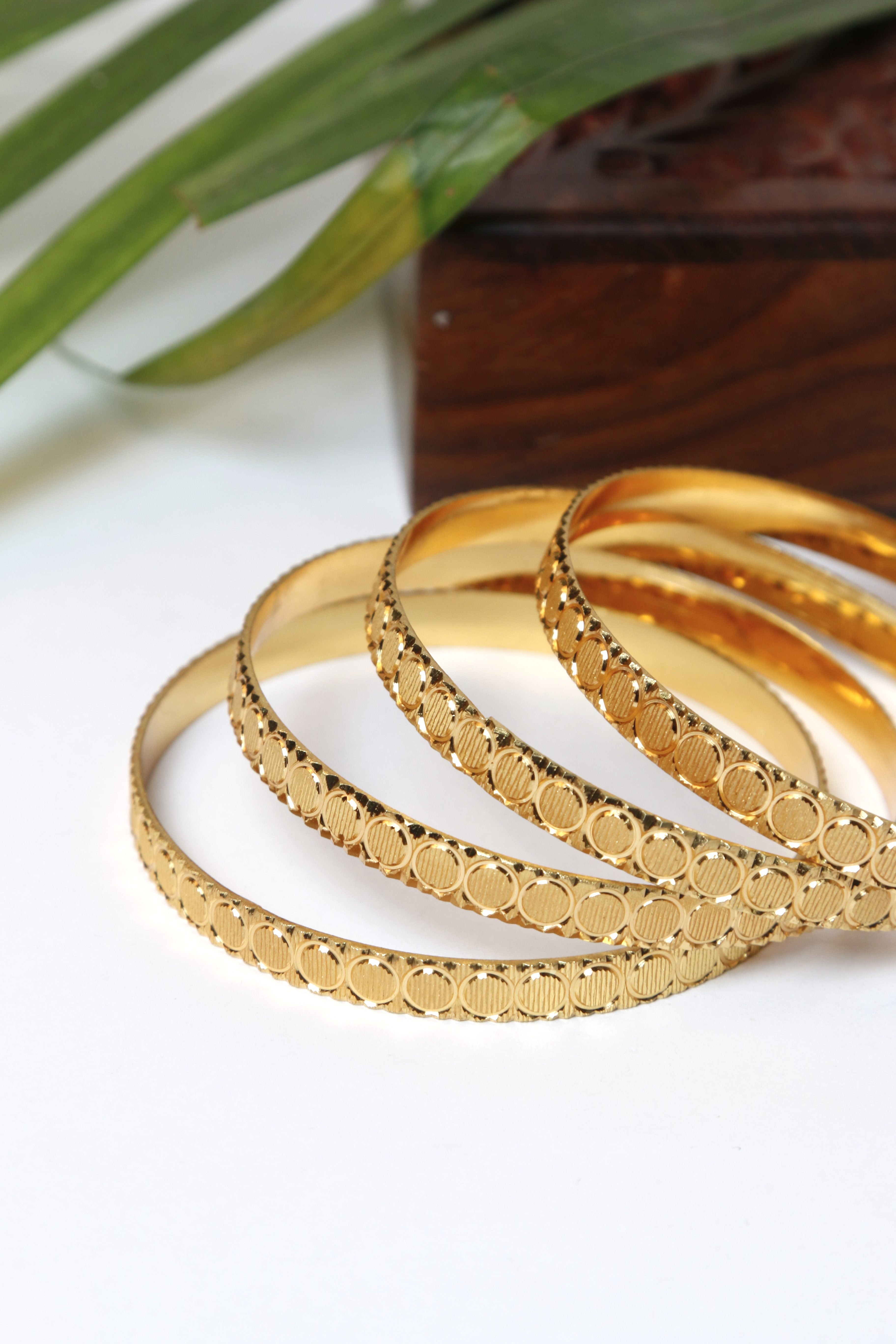 Gold Bangle Set with Elegant Circular Patterns