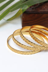 Gold Bangle Set with Elegant Circular Patterns
