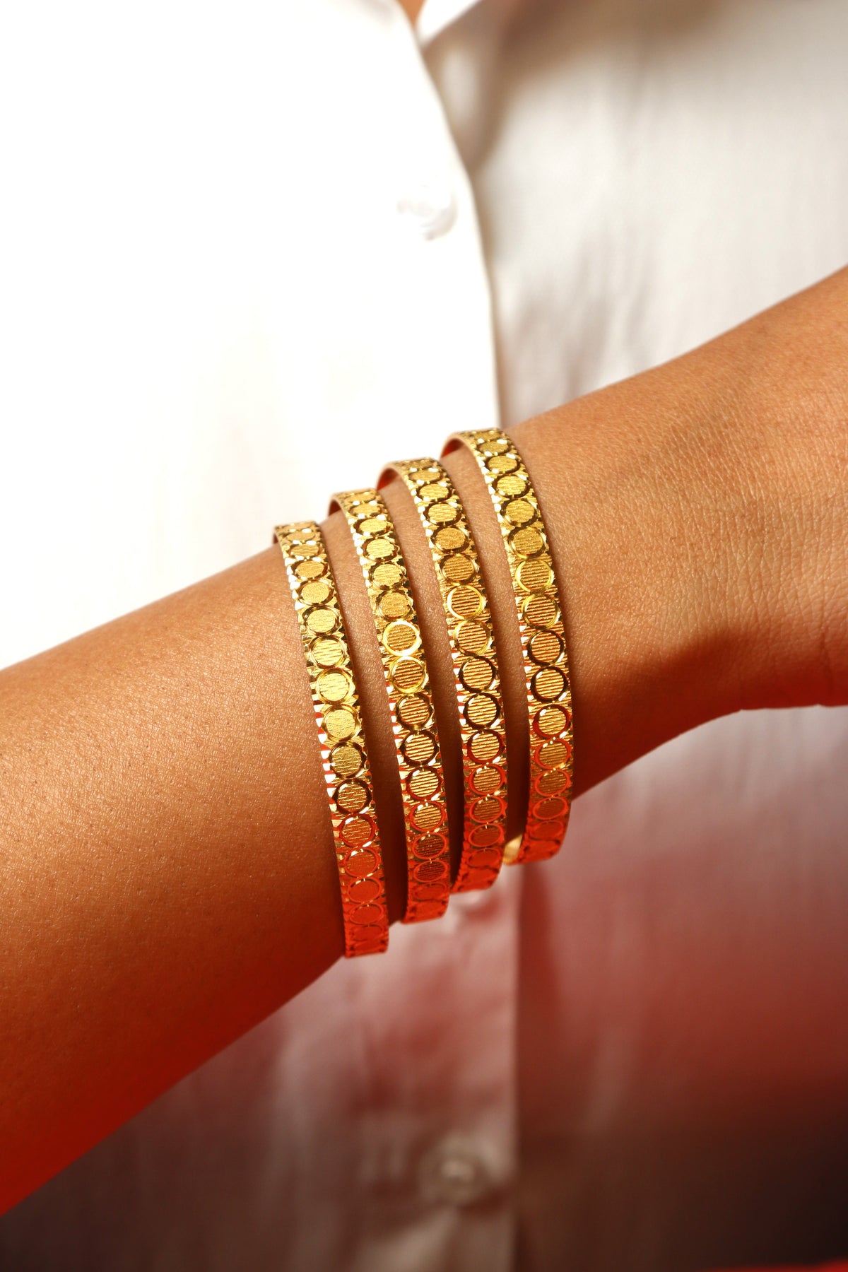 Gold Bangle Set with Elegant Circular Patterns