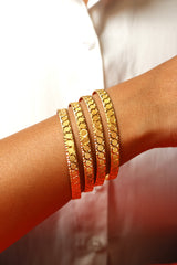 Gold Bangle Set with Elegant Circular Patterns