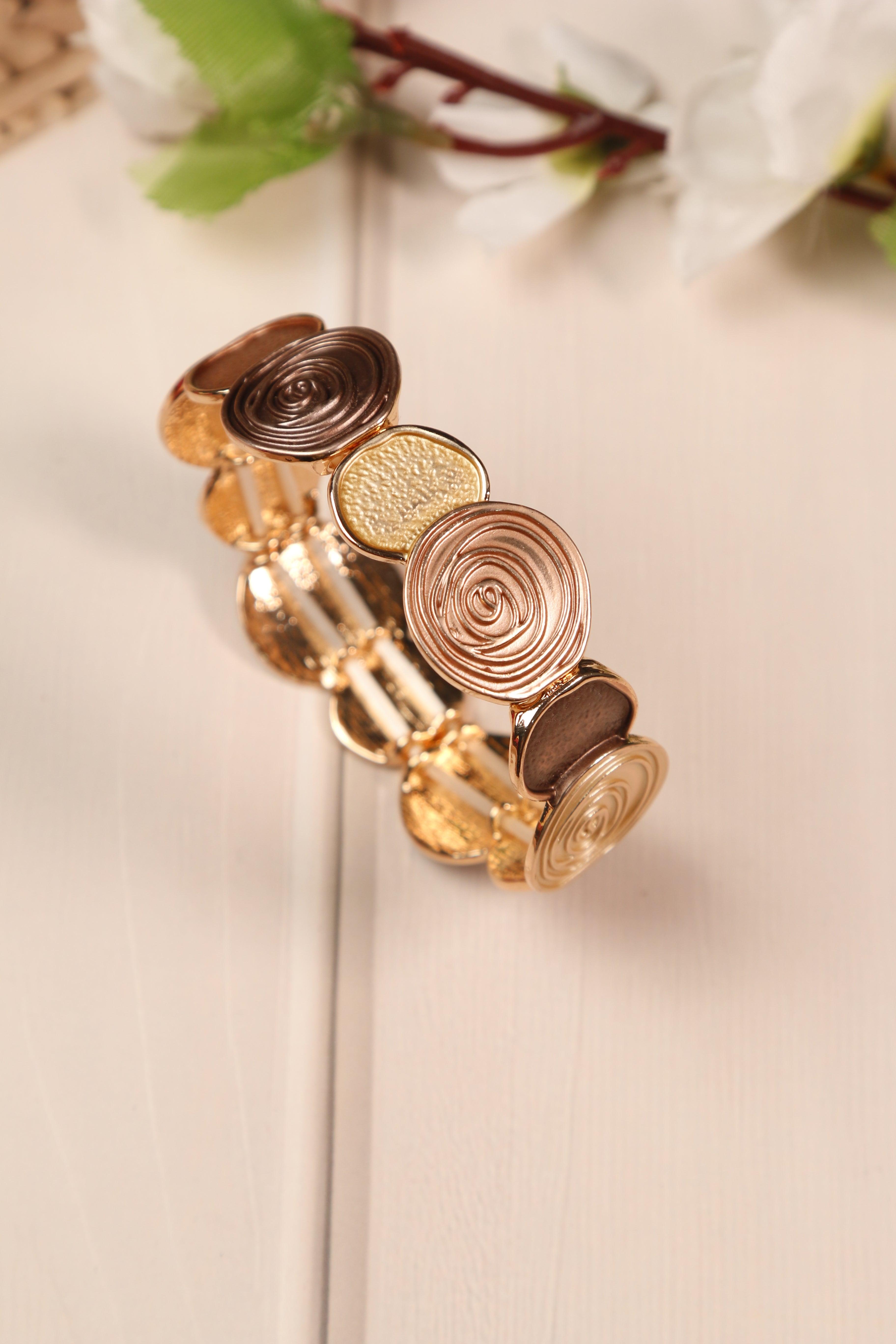 Anti-tarnish stretch bracelet with circular motifs.