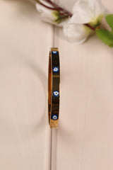 Elegant gold-tone Evil Eye bracelet with a protective charm.