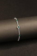 Elegant anti-tarnish bracelet with vivid green stones.