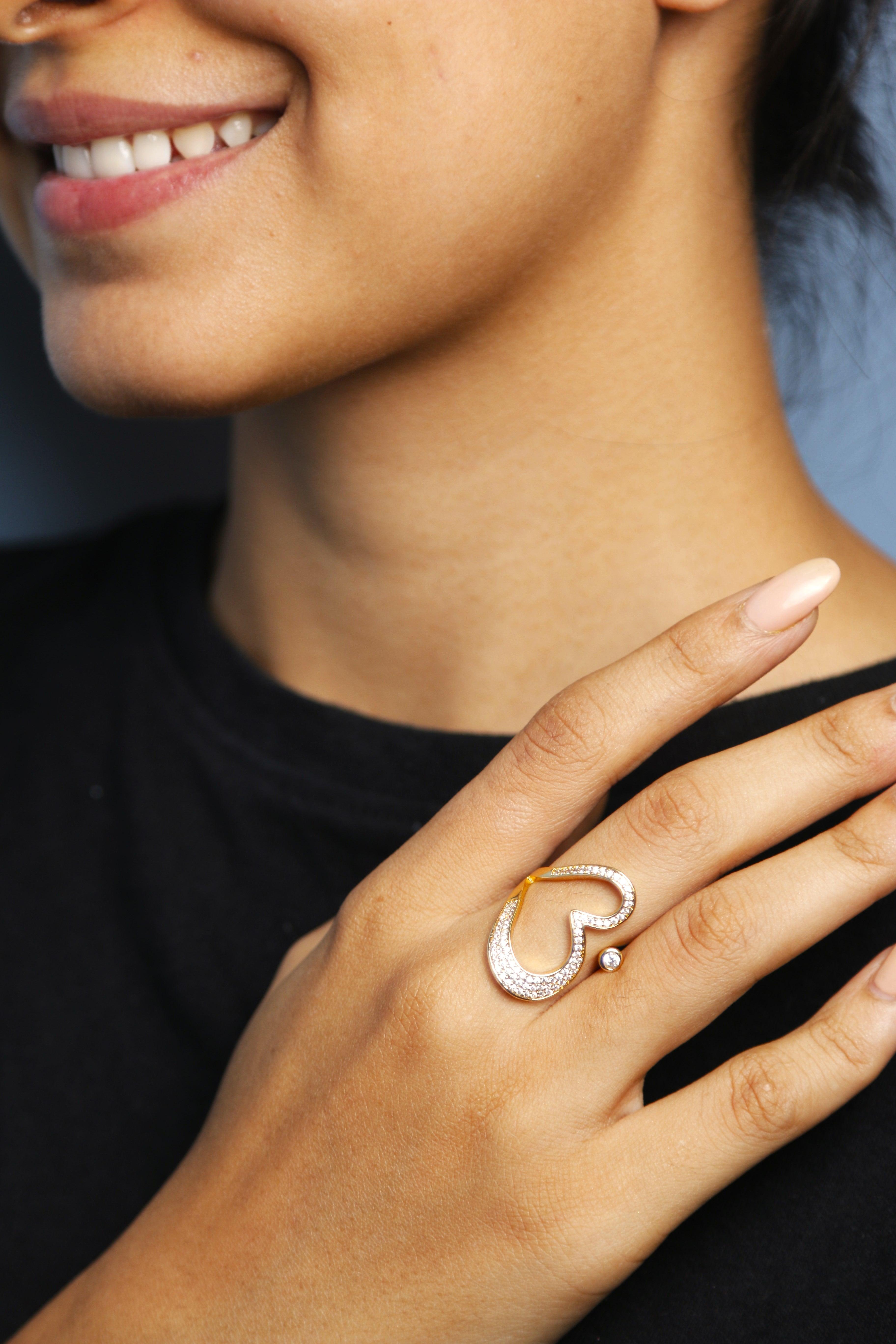 Stylish heart-shaped ring worn on hand, ideal for festive or everyday wear