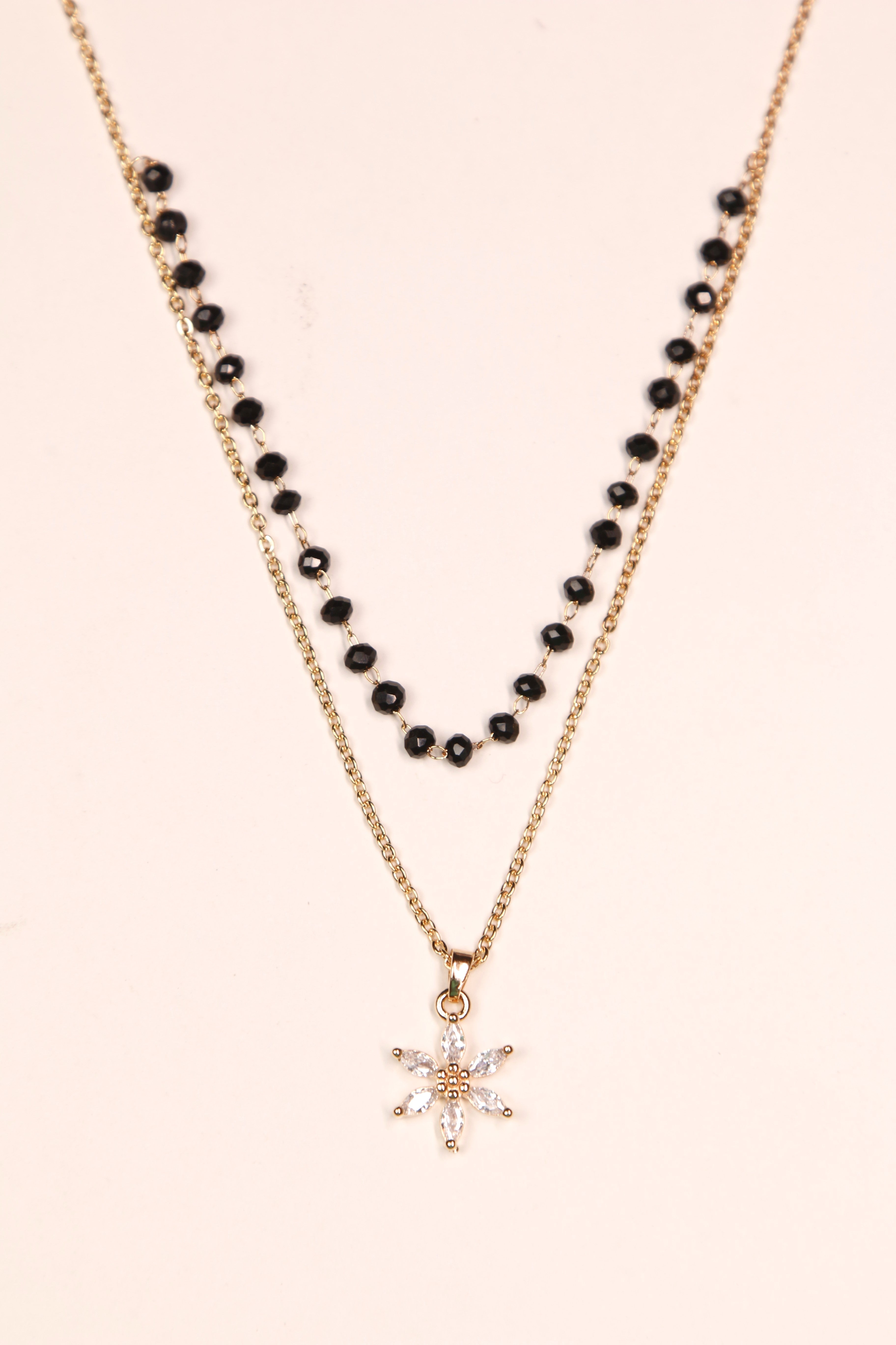 Gold mangalsutra with a star-shaped floral diamond pendant