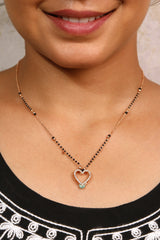Model wearing a gold heart-shaped mangalsutra